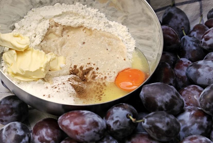 pancake batter, egg with flour and butter, plums, pancake mix