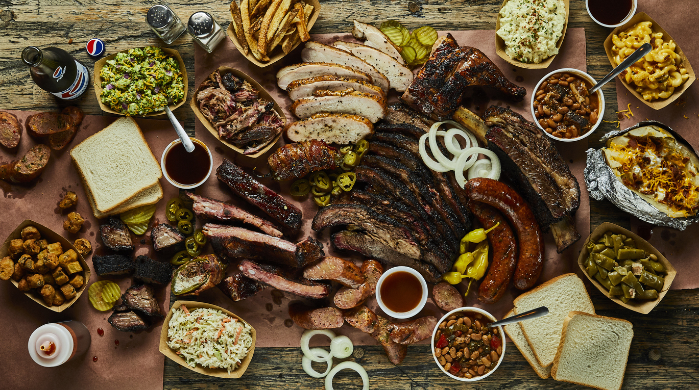 a Texas barbecue platter, with all the meat and different kinds of sides