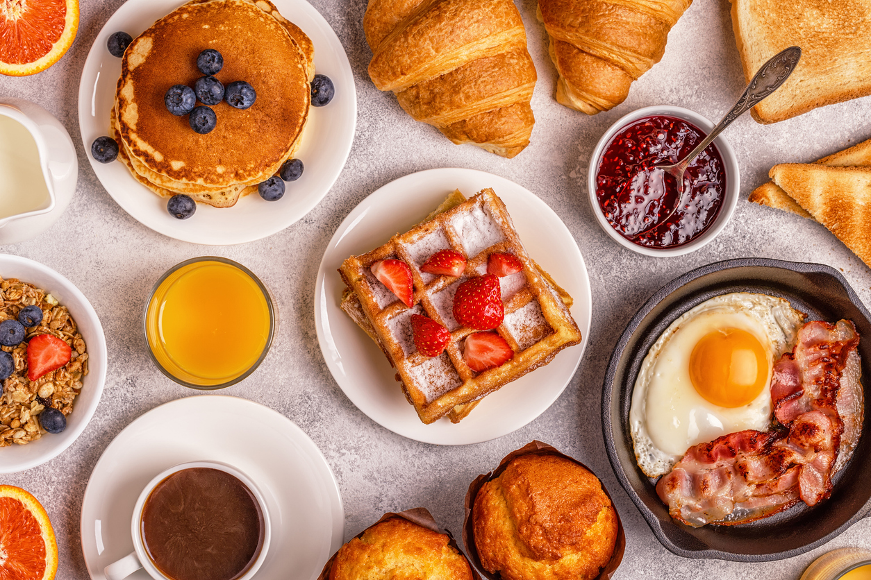 an assortment of breakfast foods on a table