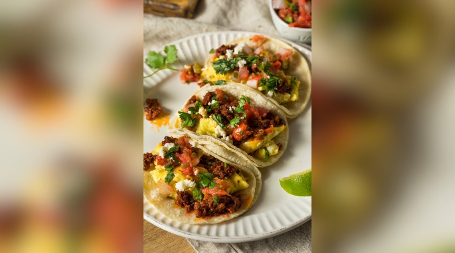 Homemade chorizo breakfast tacos with pico and cilantro