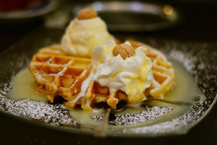 Waffle pastries and scrambled eggs