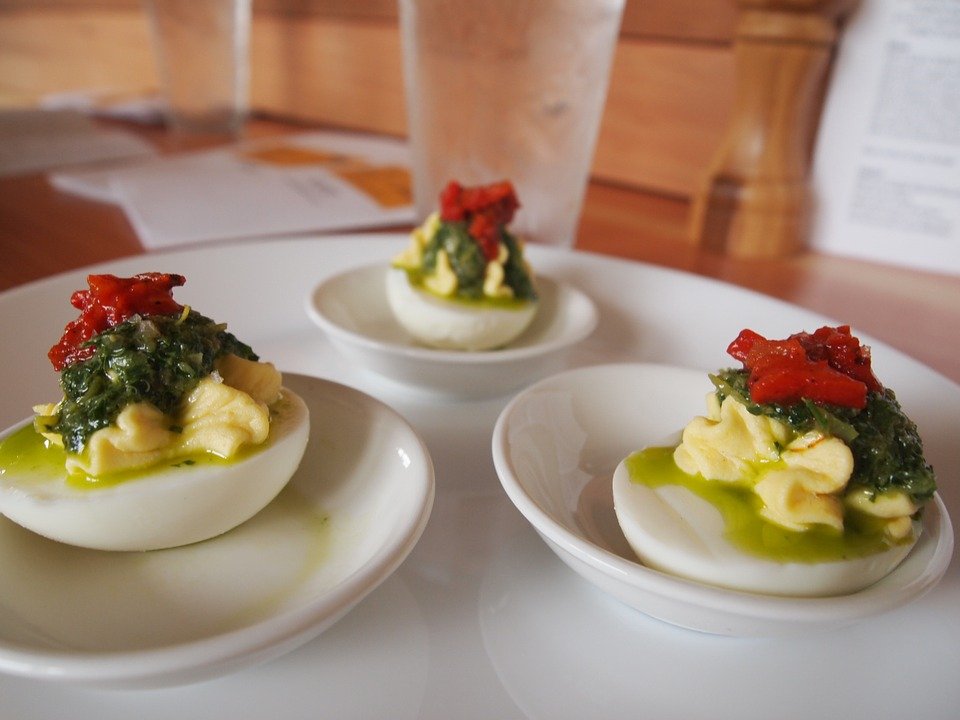 deviled eggs topped with paprika