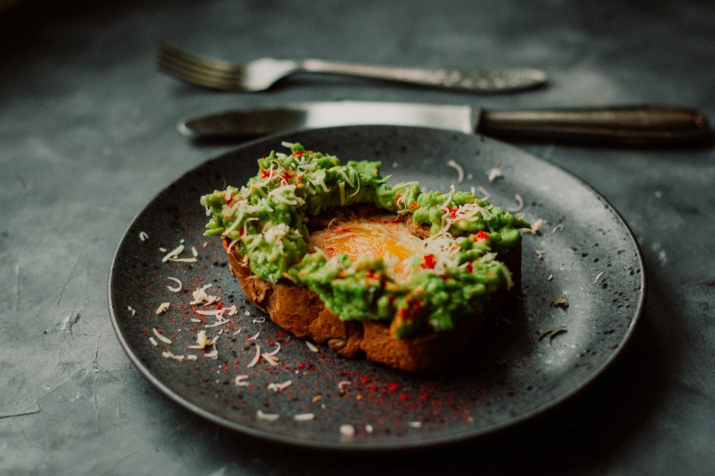 avocado on toast garnished on a plate