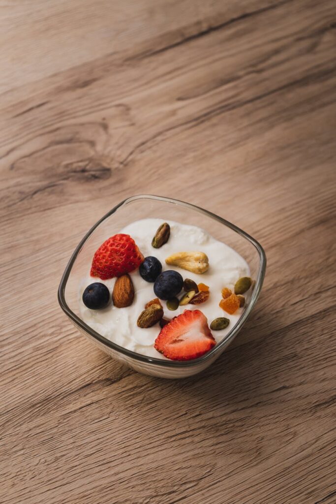 a bowl of yogurt with fruits and nuts