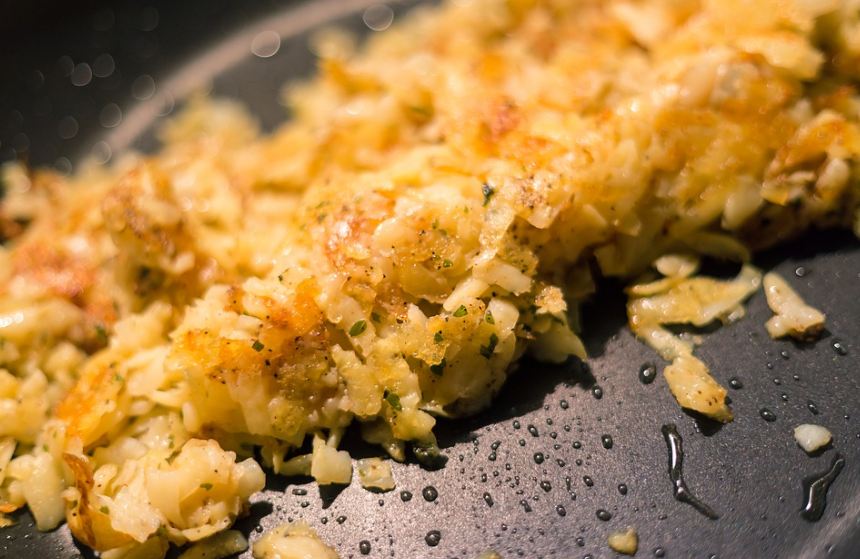 cooking hash browns on a pan