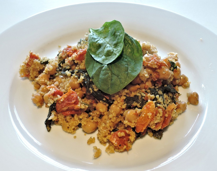 couscous served with tomatoes and spinach