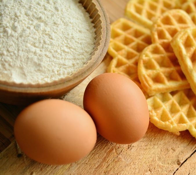 waffles, eggs, a bowl of flour