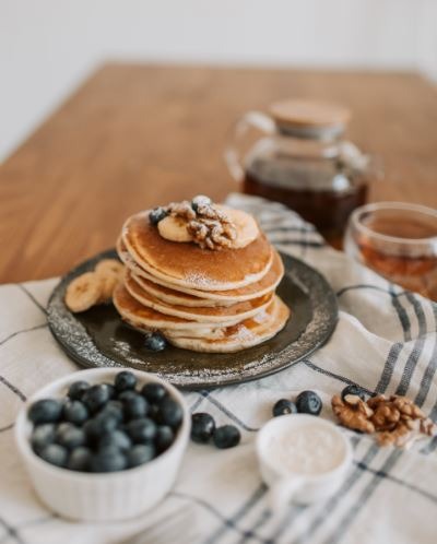 Pancakes with blueberries and banana toppings